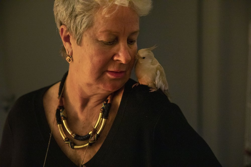 Deb Ware looks after Yazoo, her son's cockatiel, whom she's been looking after since her son has struggled with an opioid addiction, in Fountaindale, Central Coast, Australia, Thursday, July 18, 2019. Her son, Sam, has survived more than 60 overdoses in 12 months. Image courtesy of David Goldman. Australia, 2019.