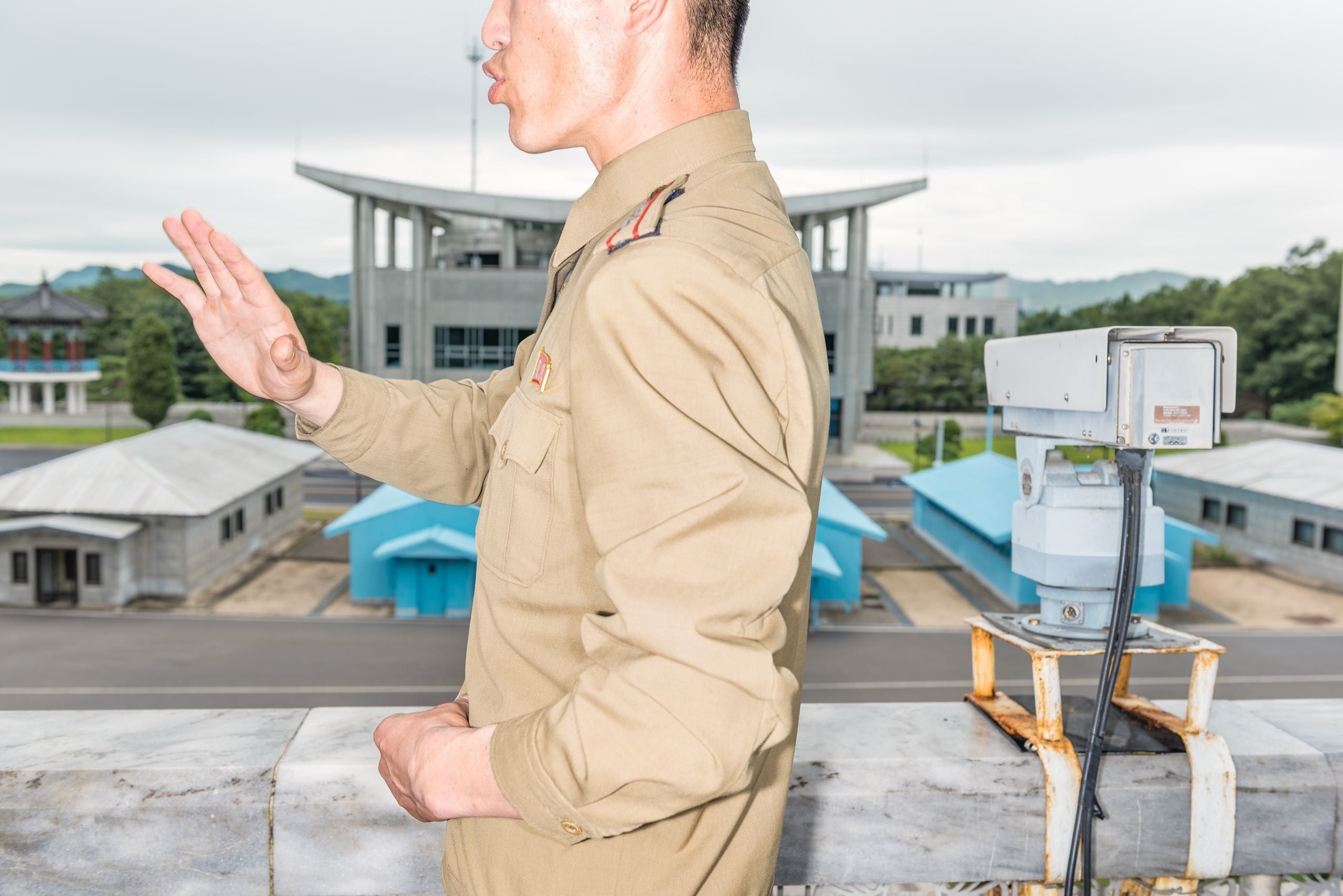 A military officer at the D.M.Z. This summer, the prospect of a nuclear confrontation between the United States and North Korea, the most hermetic power on the globe, entered a realm of psychological calculation reminiscent of the Cold War. Image by Max Pinckers/The New Yorker. North Korea, 2017.