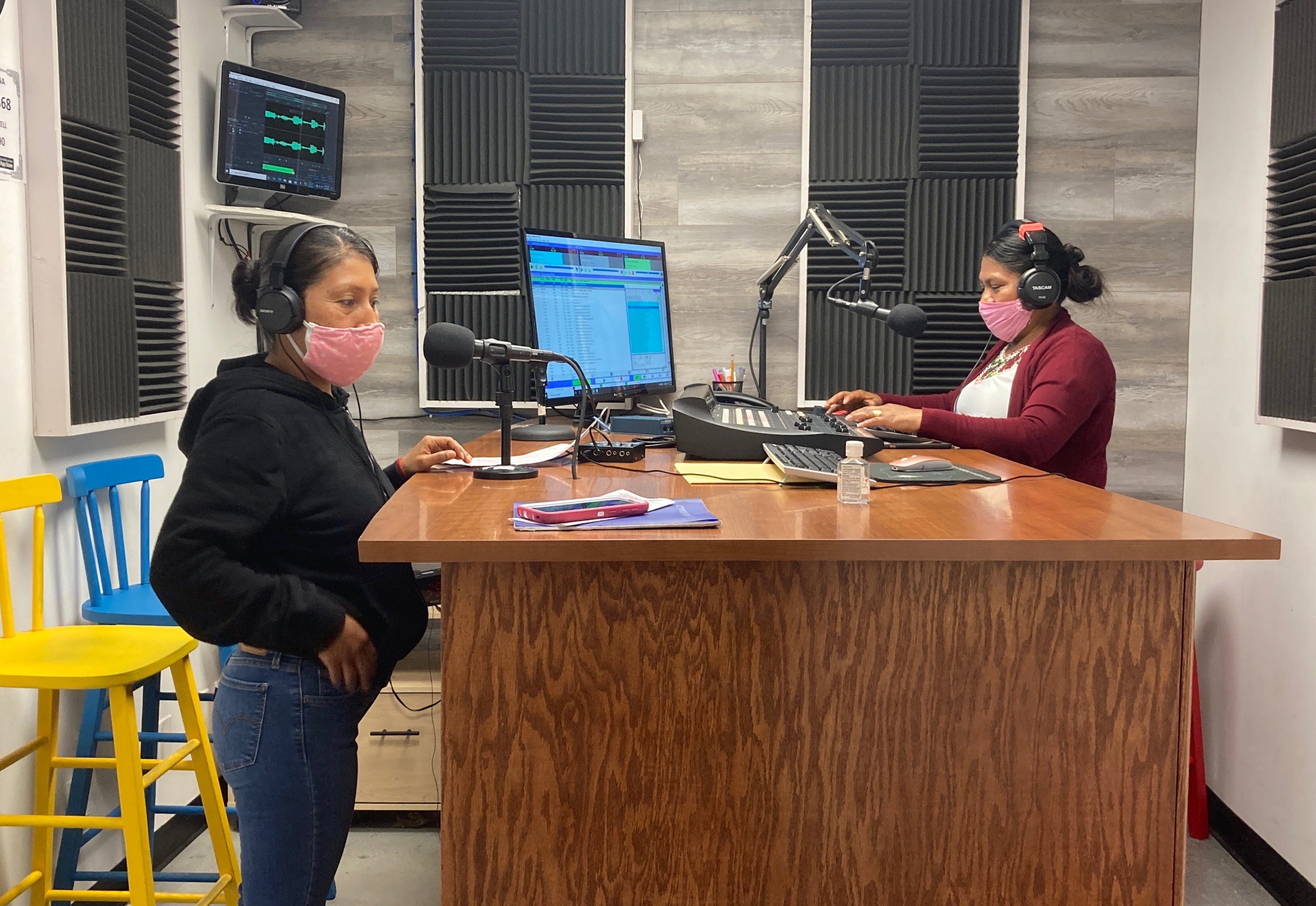 Lidia López and Flor López, who are not releated, broadcast "Voz de la Mujer Indígena" from Radio Indígena's programming booth in Oxnard in July. Image by Julia Knoerr. United States, 2020.