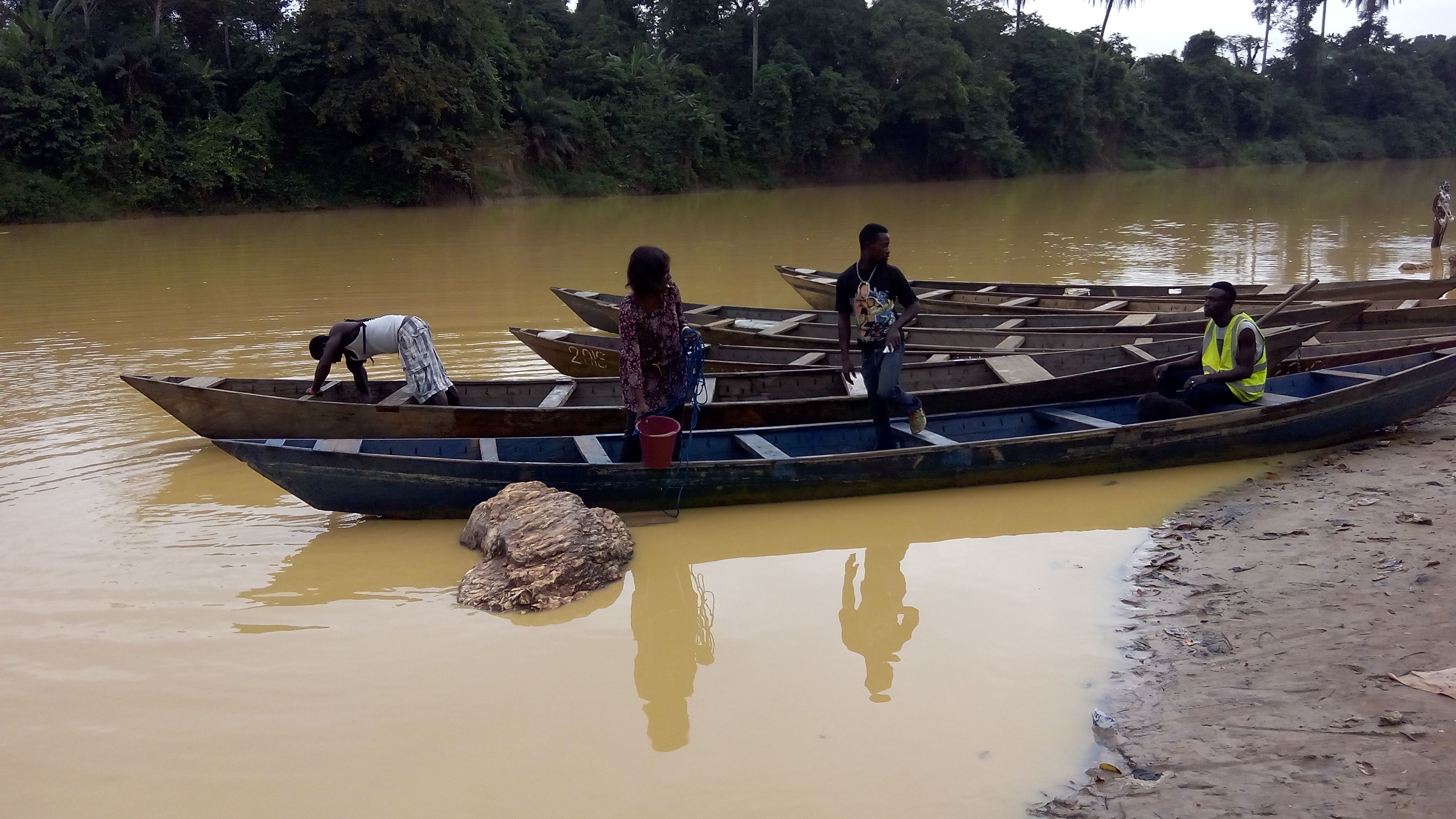 Adwoba Edjah of the Ghana Atomic Energy Commission and her team collect water samples to check for contaminants from illegal mining. She will test samples at a research reactor in Accra, Ghana's capital. Image courtesy of Adwoba Edjah. Ghana, 2017.