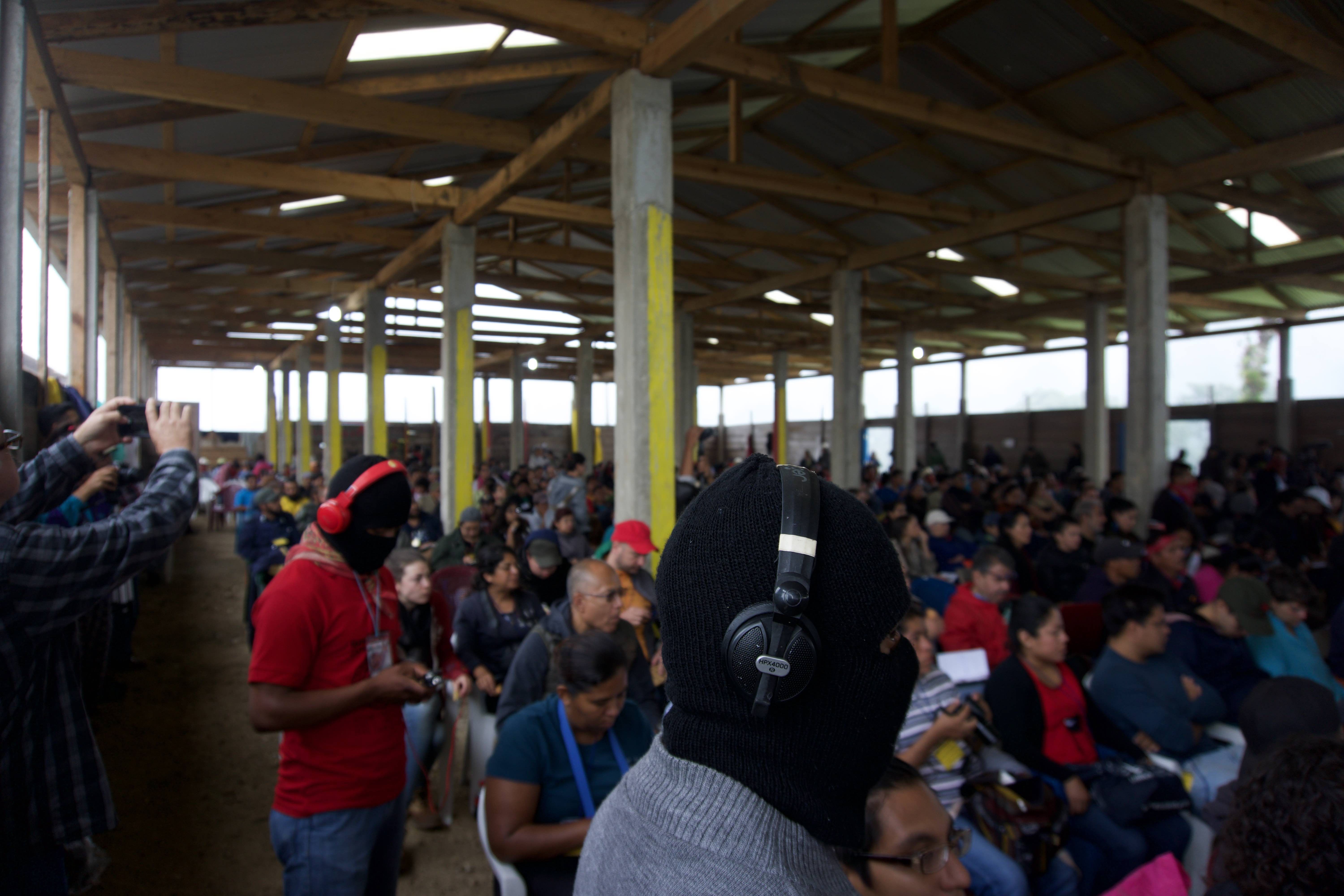 At the final meeting of a three-day-long “encuentro,” or political gathering, in the village of Morelia—deep in the Zapatista autonomous zones—participants filled a pavilion to listen to speeches summarizing the results of the previous day’s debates. Here, a Zapatista activist records the speech of Subcomandante Galeano, the de facto spokesman for the Zapatistas. Image by Jared Olson. Mexico, 2018.
