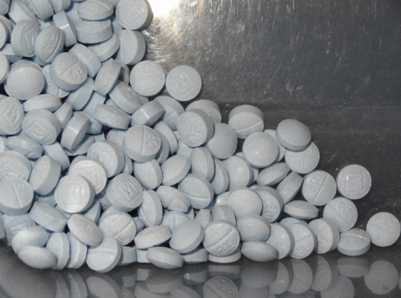This photo provided by the U.S. Attorneys Office for Utah and introduced as evidence at the Aaron Shamo trial shows fentanyl-laced fake oxycodone pills collected during the investigation. Shamo called himself a “white-collar drug dealer,” drew in co-workers from his time at eBay and peppered his messages to them with smiley-face emojis. Image courtesy of U.S. Attorneys Office for Utah. United States, 2019.