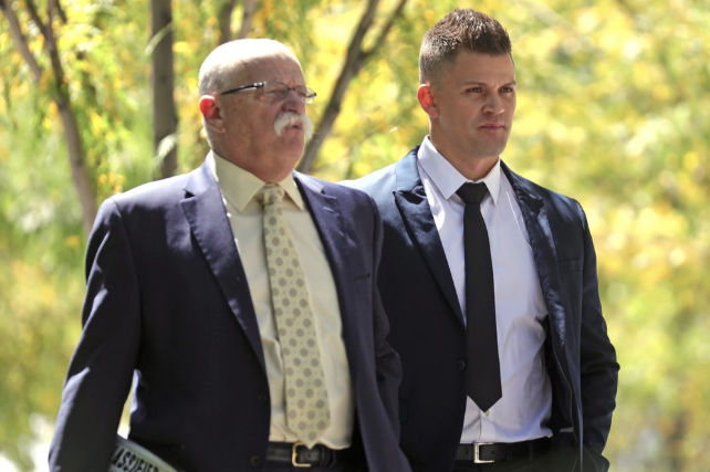 In this Aug. 23, 2019, photo, Jonathan Luke Paz, right, leaves the federal courthouse after testifying, in Salt Lake City. He has pleaded guilty to helping Aaron Shamo press potentially poisonous fentanyl-laced counterfeit prescription drug pills and agreed to testify against him. Image by Rick Bowmer. United States, 2019.