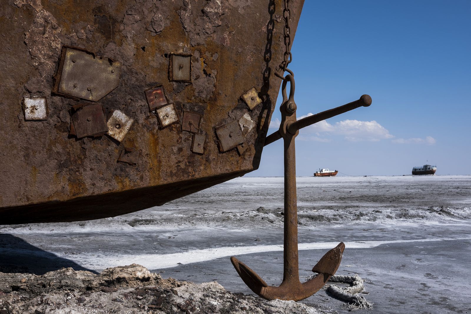The remains of a large cargo ship marooned on the dried-out seabed of Lake Urmia. Image by Ako Salemi. Iran, 2016. 