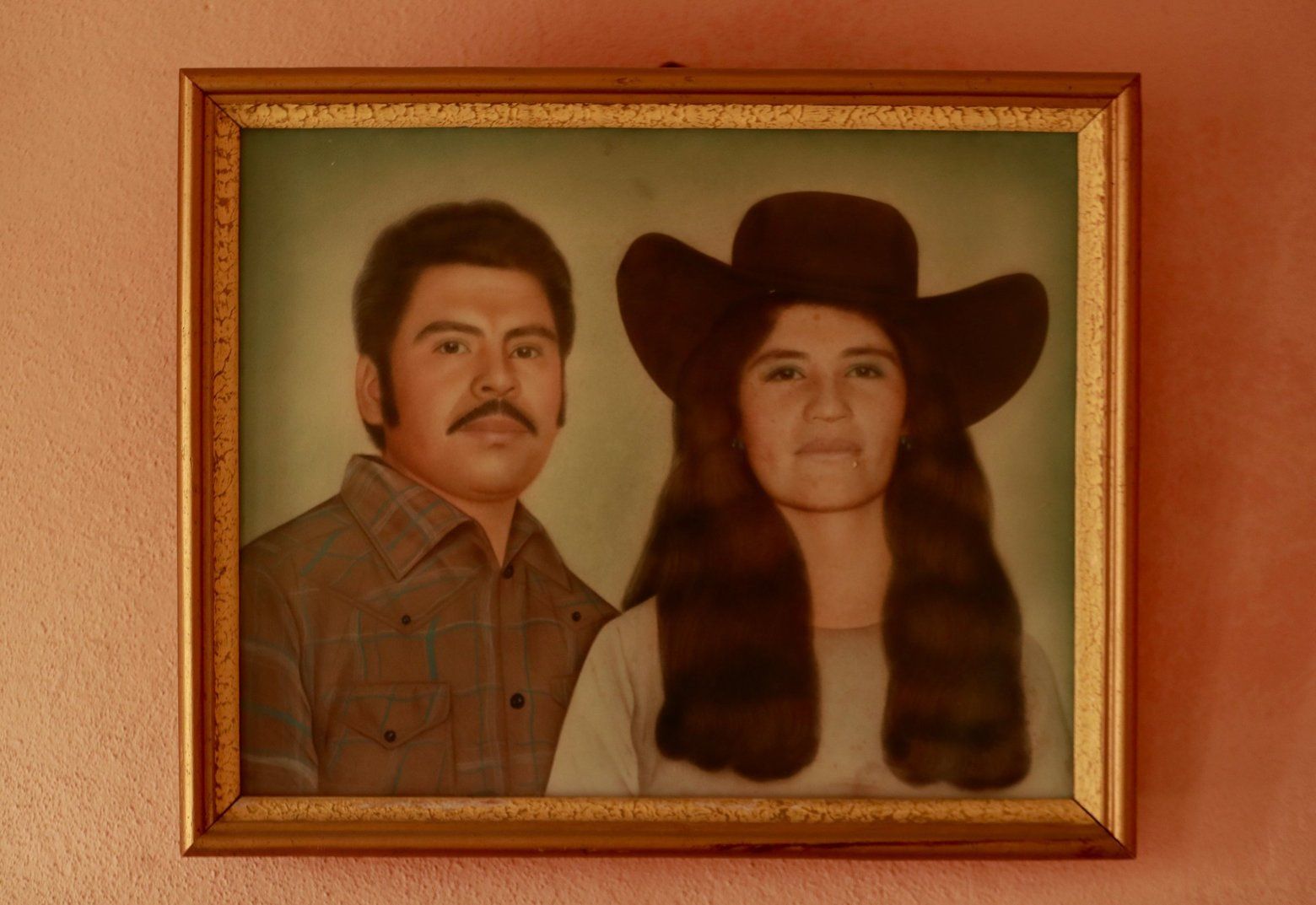 A portrait of Rafael’s parents is displayed in his home in Zacatecas. Image by Erika Schultz. Mexico, 2019. 