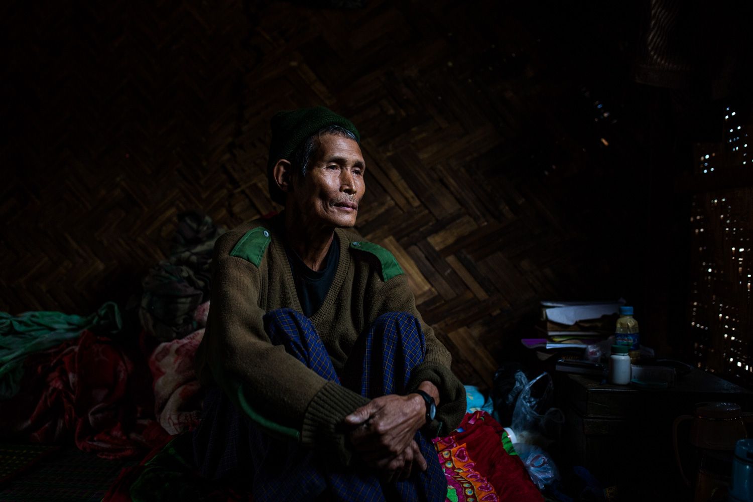 Dawng Hkawng, who was displaced by the Chipwi dam project in 2012, sits in his small room in the Chipwi internally displaced persons camp in Chipwi, Kachin State, Myanmar. Image by Hkun Lat. Myanmar, 2019.