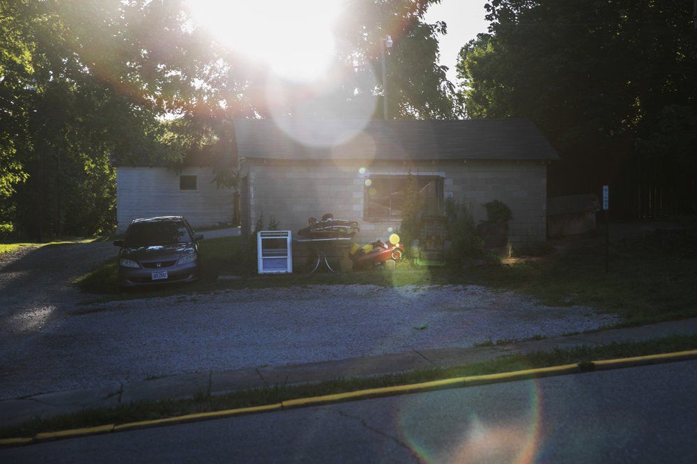 The evening sun shines on a toy car in front of a home in Shawnee, Ohio, on Tuesday, July 28, 2020. Shawnee was a coal town that once boasted an opera house, a vaudeville theater, dozens of stores and plenty of taverns. Image by Wong Maye-E/AP Photo. United States, 2020.