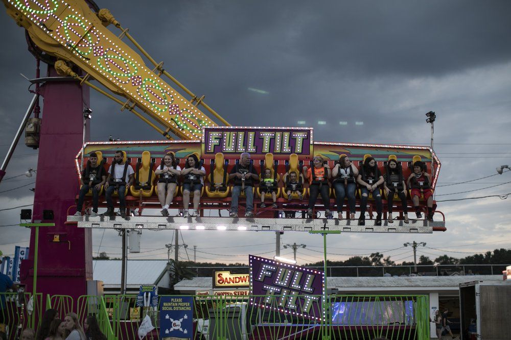 Visitors to the Perry State Fair in New Lexington, Ohio ride the “Full Tilt” on Friday, July 24, 2020. Image by Wong Maye-E/AP Photo. United States, 2020.