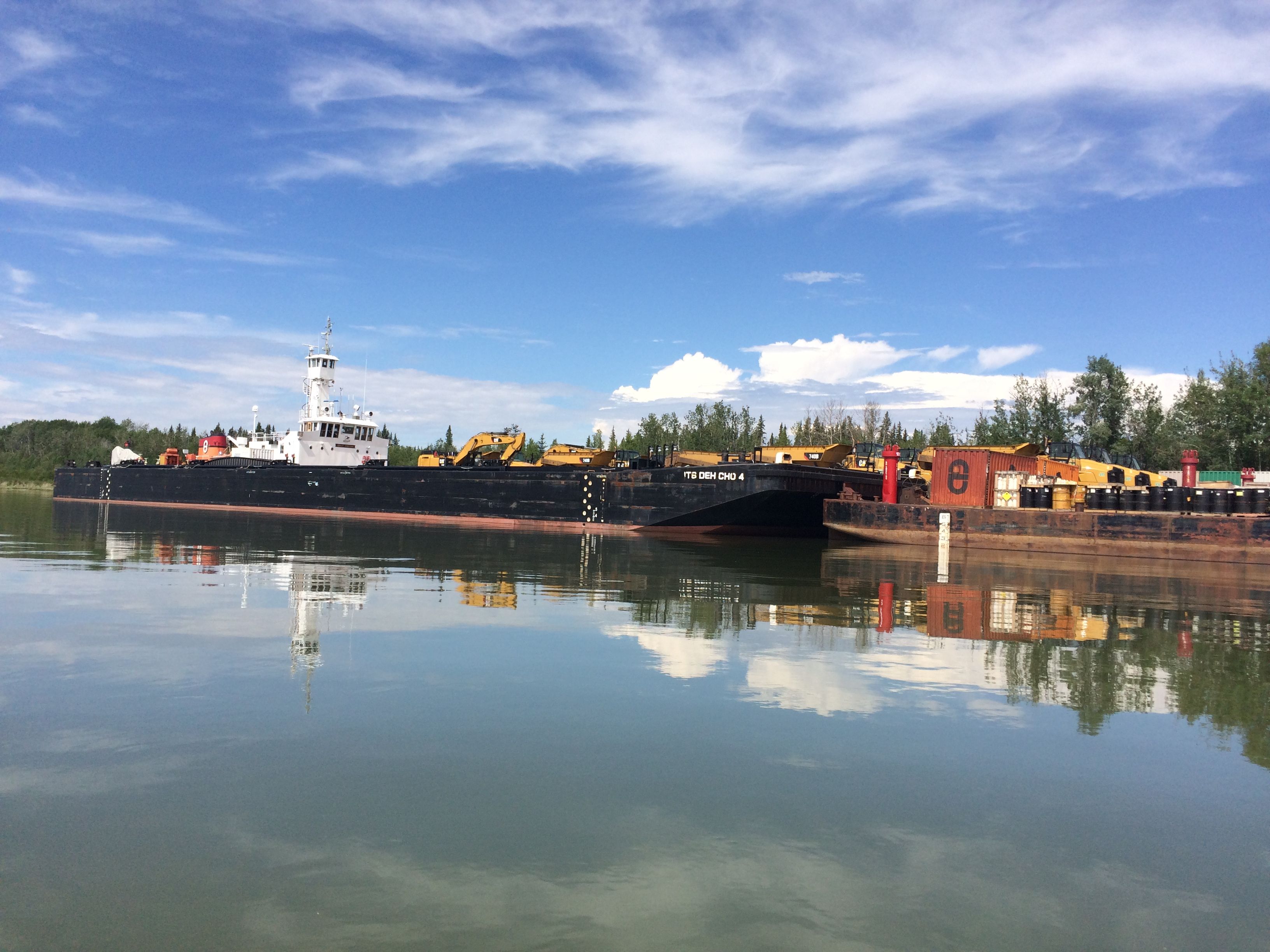 An NTCL barge and tug on the Mackenzie River. Image by Brian Castner. Canada's Northwest Territories, 2016.