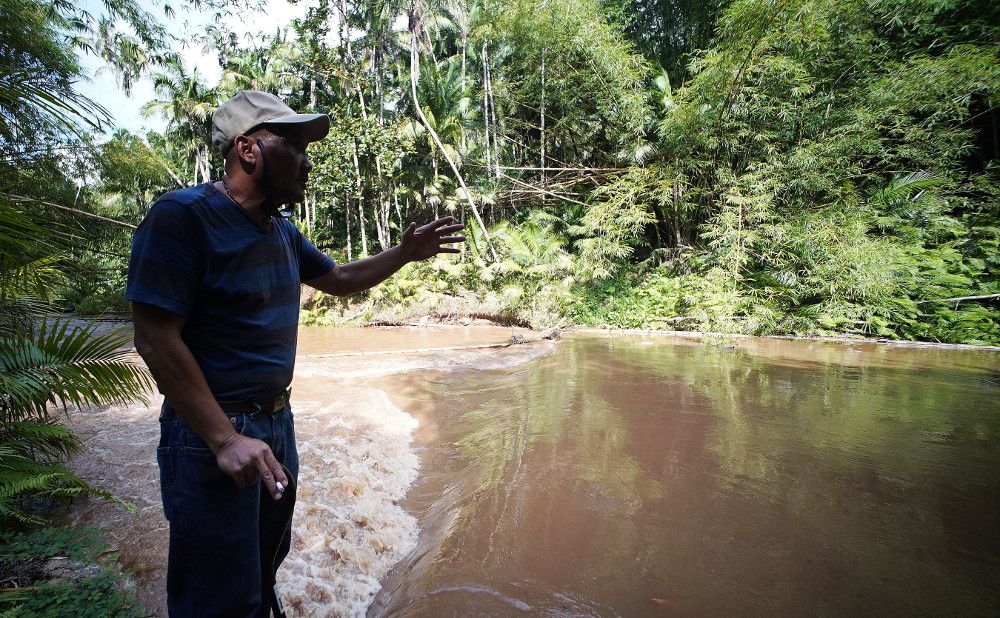 B.J. says the river was calmer the day that Fr. Louis Brouillard tied him to a tree and raped him three times. He says he was bleeding and didn't understand what was happening. Image by Cory Lum. Guam, 2017.