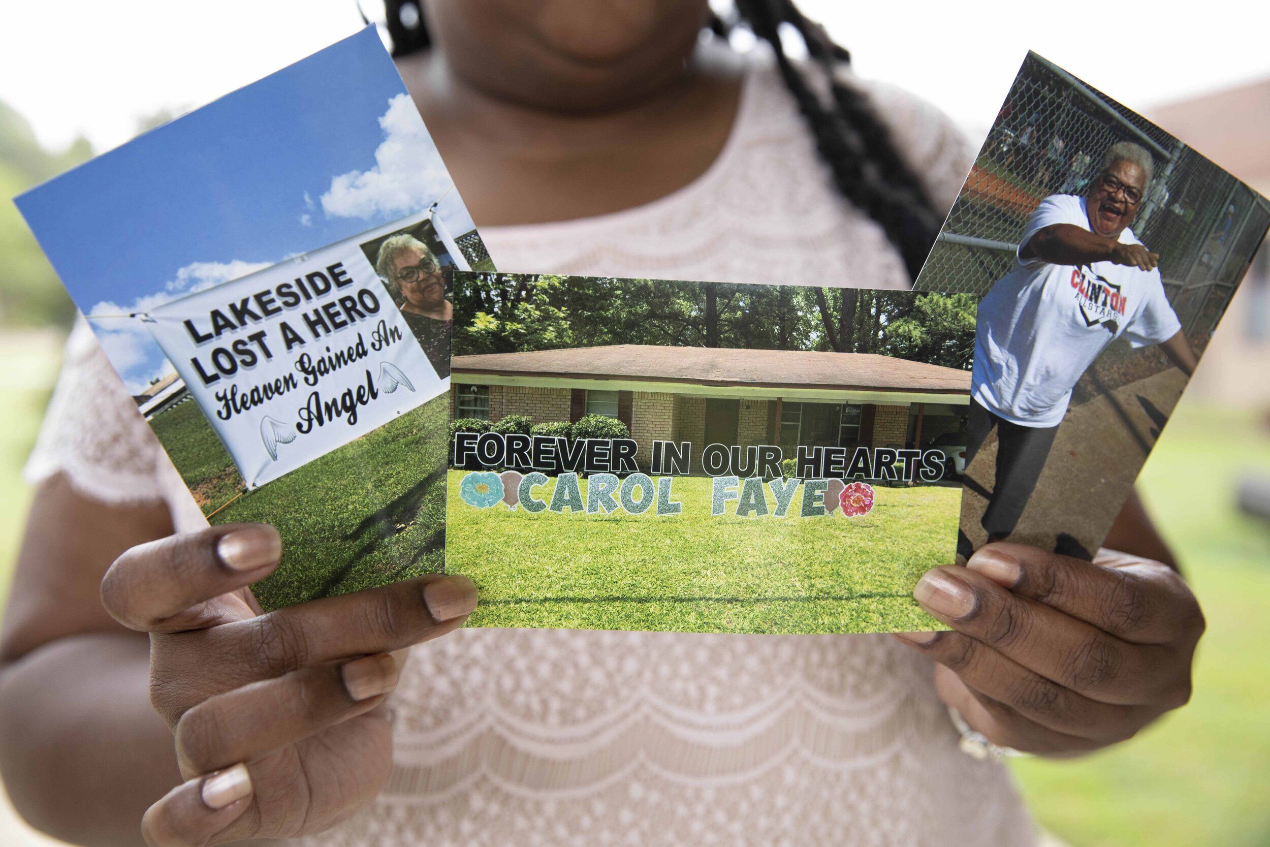 Shenika Jackson holds photos memorializing her late mother, Carol Faye Doby, who died from complications of COVID-19 earlier this year. Friday, September 25, 2020 in Bolton, MS. Image by Sarah Warnock/MCIR. United States, 2020.