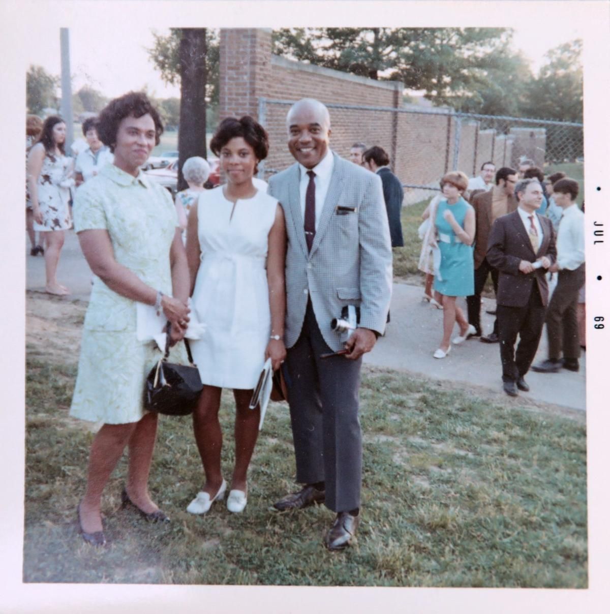Judy Gladney, center, in a photograph with her parents, Clarice, left, and Dr. John Gladney at her University City High School graduation in 1969. Image courtesy of Judy Gladney. United States, 1969.