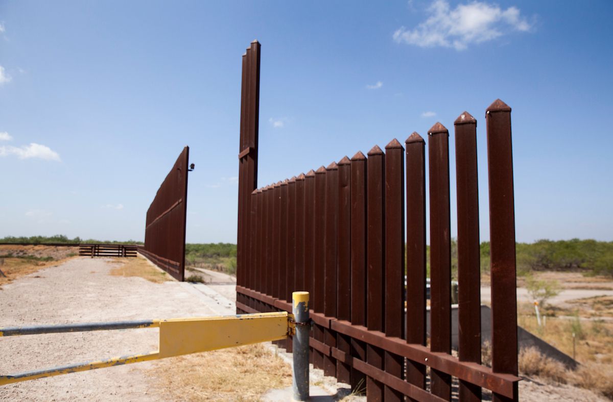 A section of the border wall stretches through the Rio Grande Valley sector of the Texas border on Aug. 20, 2019. Image by Jinitzail Hernández. United States, 2019.