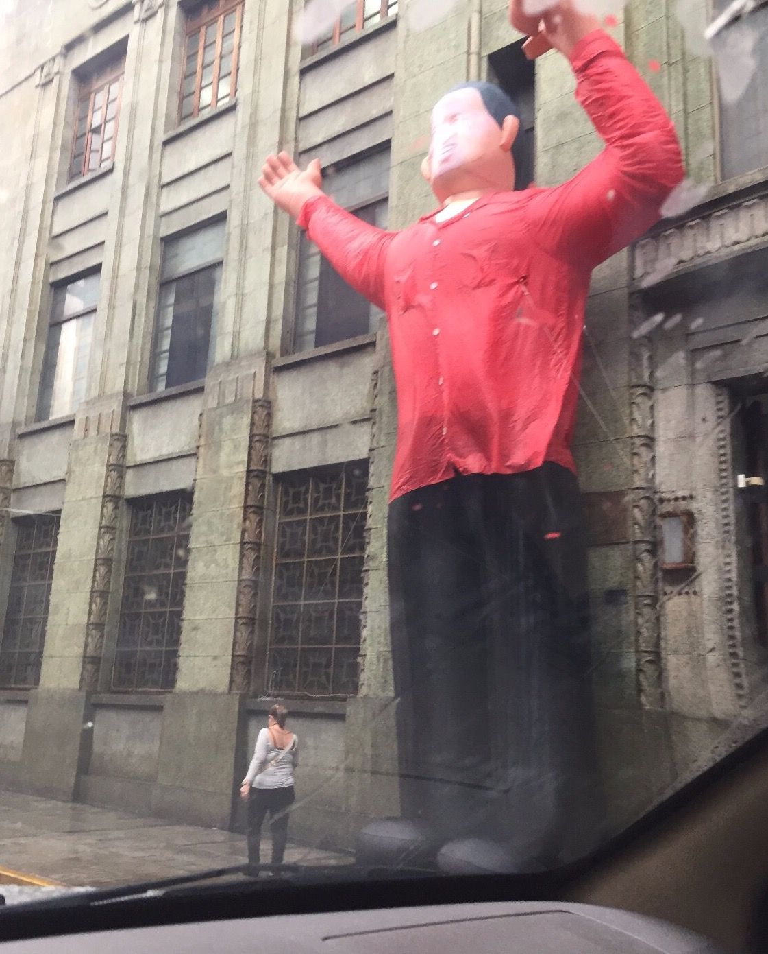 Inflatable figure of Hugo Chávez outside a building in the city's downtown area. Image by Fernando Gago. Venezuela, 2017.
