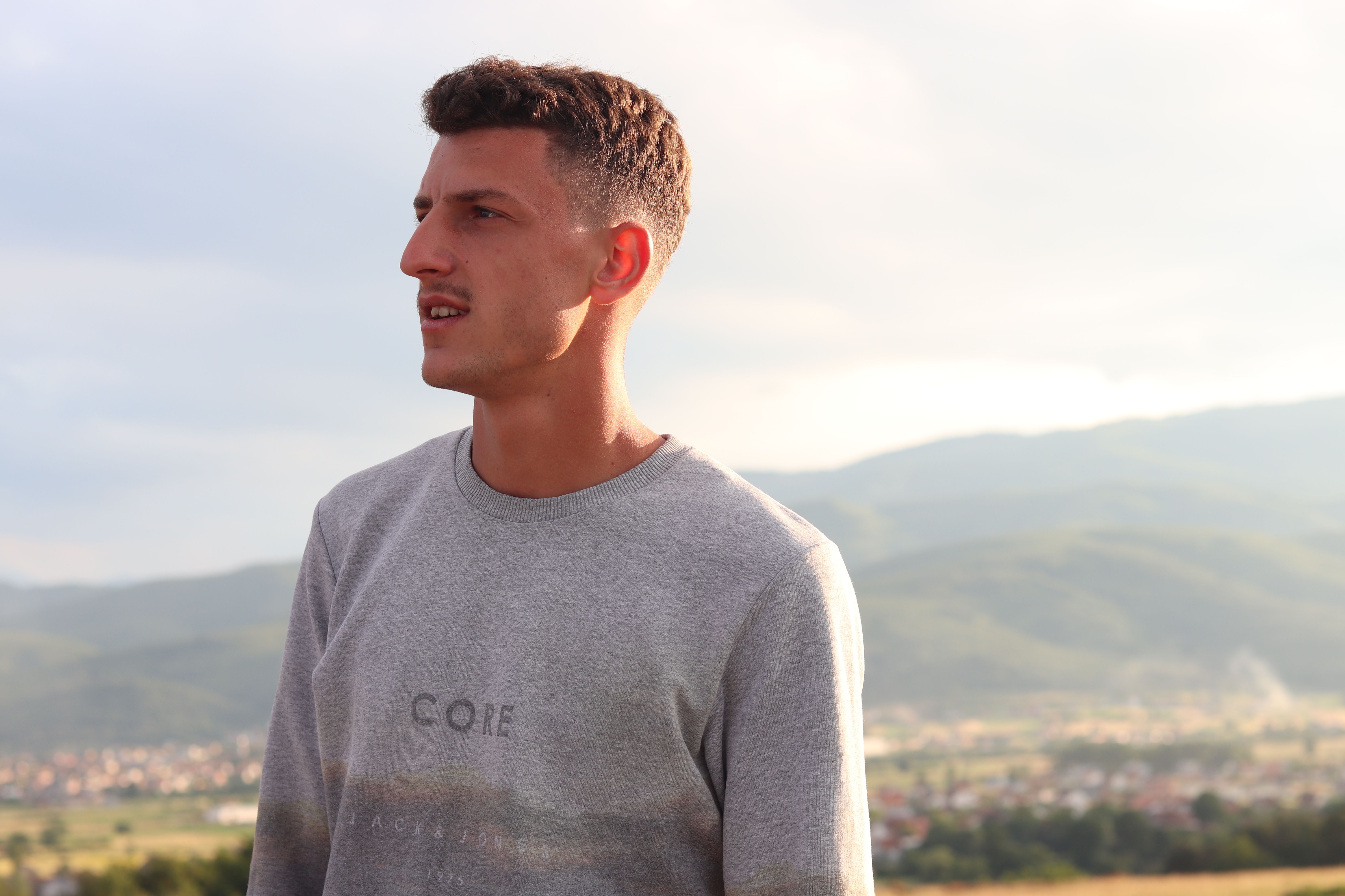 Albin Heta, 19, the cousin of Blerim Heta, poses in his small village called Varosh. Blerim left to fight for jihad in Syria on August 7, 2013. On March 25, 2017, Blreim became one of two Kosovo-Albanian suicide bombers, killing himself and 52 Iraqis in a bombing in Baghdad. “He was polite and nice, but in three months, he changed completely,” said Albin. Image by AJ Naddaff. Kosovo, 2018.