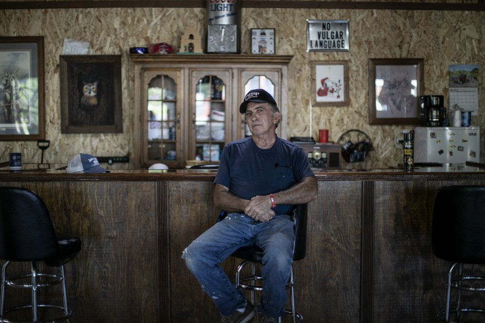 Rick Warren 65, poses for a portrait in The Gunsmoke Club Tuesday, Aug. 4, 2020, in West Vienna, Ill. "I've had Black friends. I've had Black babysitters. I had Black people who took care of me through my childhood," he said. But the easygoing race relations of his youth were lost, he said, when President Lyndon Johnson, who pushed through some of the most important civil rights legislation of the 20th century, "came along and turned it into a bunch of racial bullshit!" Image by Wong Maye-E/AP Photo. United States, 2020.