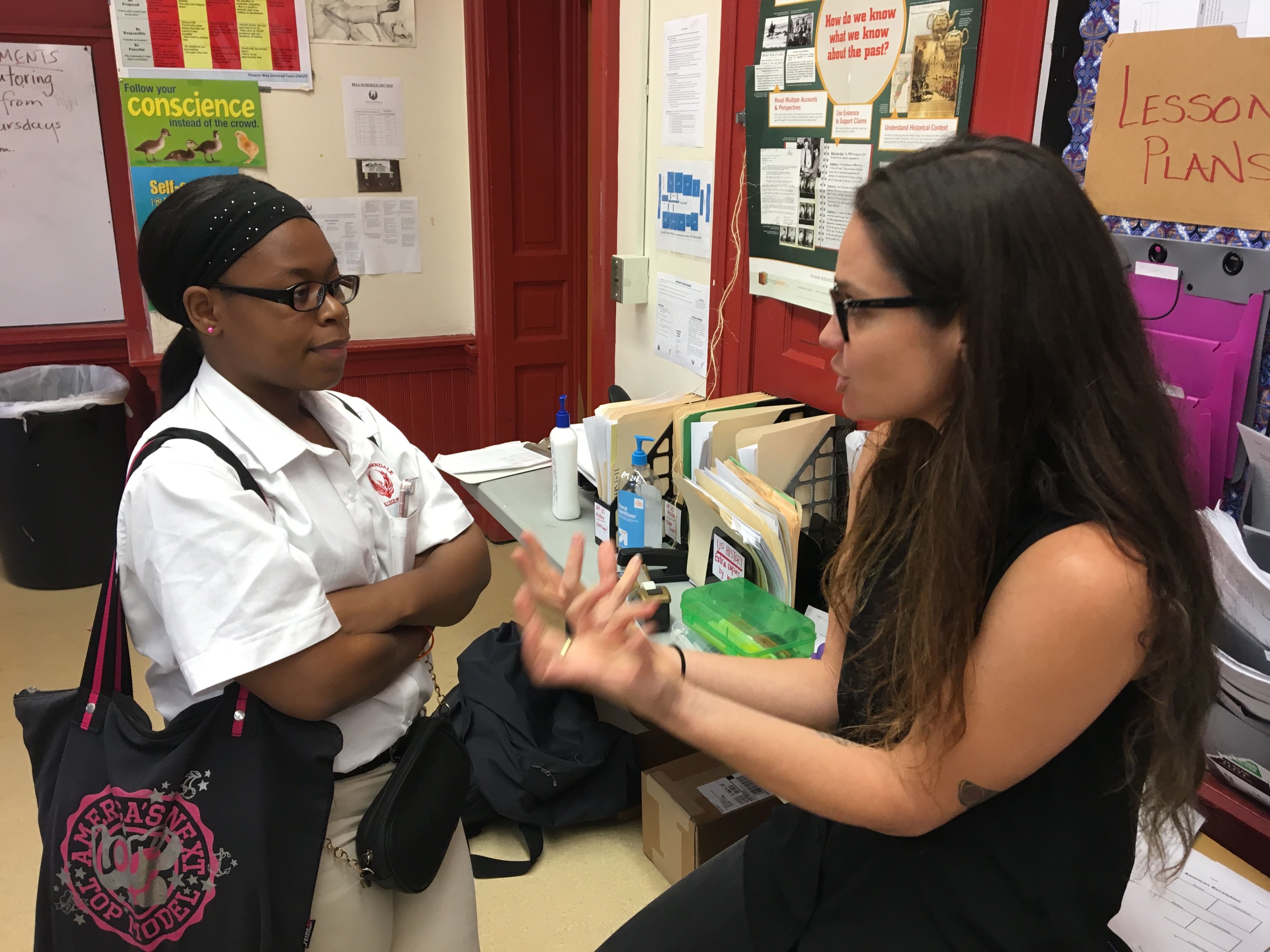 Natalie Keyssar talks to a student at North Lawndale College Prep