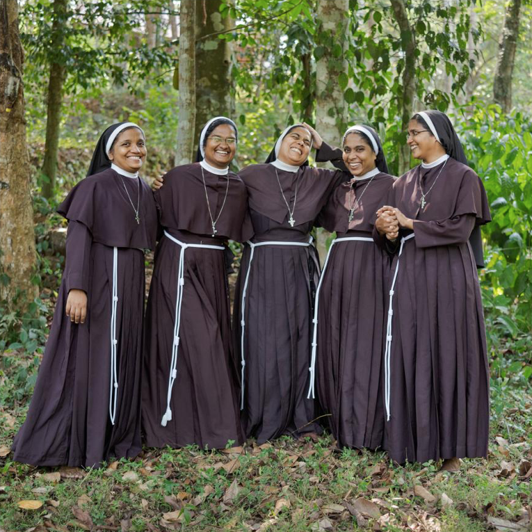 Defiant Sisters, India: Their superiors keep pressuring them to keep quiet and stop making trouble, but they refuse. When a nun in Kerala told church leaders multiple times that a bishop had raped her repeatedly, nothing happened, so she turned to the police. Months later, in September 2018, these fellow nuns joined a two-week protest outside the Kerala High Court. The bishop, who maintains his innocence, eventually was arrested. From left: Sisters Alphy, Nina Rose, Ancitta, Anupama, and Josephine. Instead of supporting the nuns, the church cut off the protesting nuns’ monthly allowance. Image by Lynn Johnson. India, 2019.