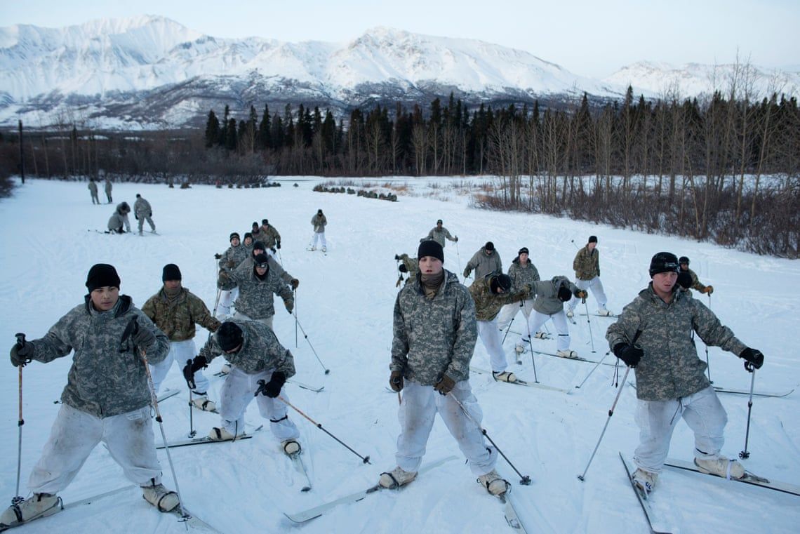 U.S. soldiers from bases in Alaska train to ski while attending a course about using snowshoes, survival and logistics in cold weather conditions. They are just south of the Arctic circle, at the Northern Warfare Training Center, a U.S. army installation in Black Rapids, Alaska. Part of their training is based on the Winter War fought by Finland against the Soviet Union in 1939. Image by Louie Palu / Zuma Press. United States, undated. 