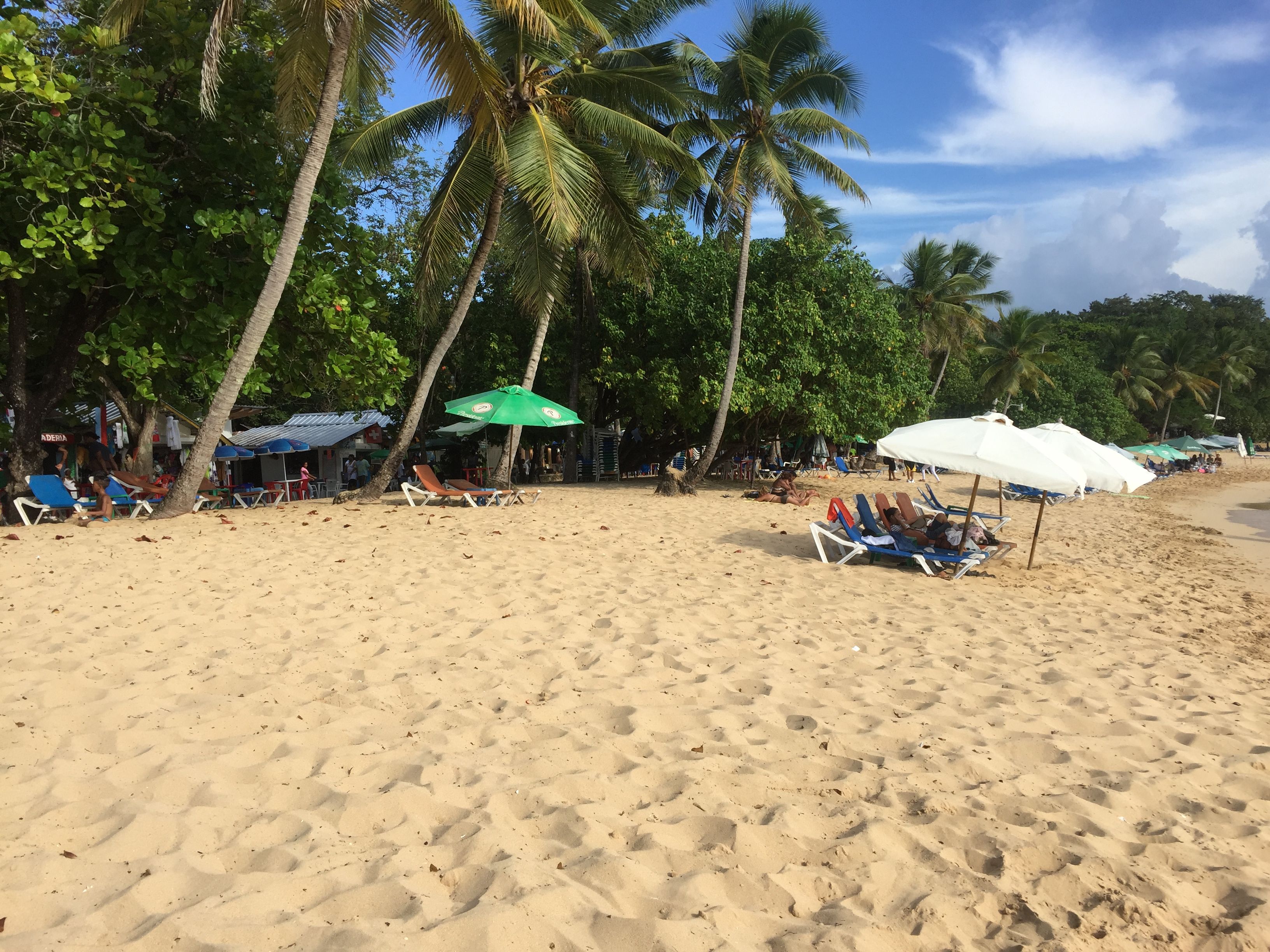 The main beach in Sosua, Dominican Republic. Women, facing few job prospects, travel to Sosua from across the island to find work in the sex industry. Locals say it’s common to see sex workers walking on the beach, looking for clients. Image by Emily Codik. Dominican Republic, 2017.