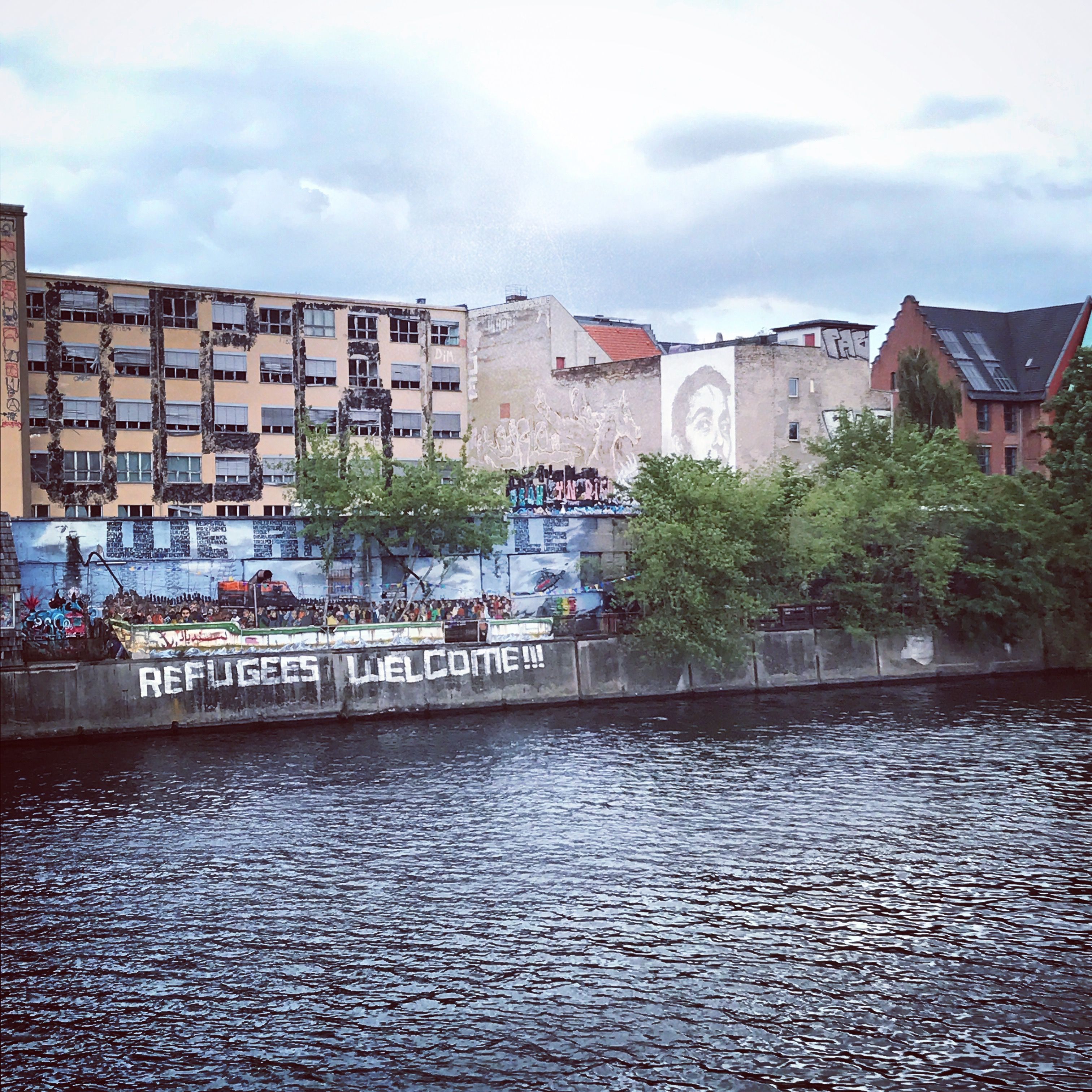 "Refugees Welcome" written on a wall in Berlin. Germany took in the most refugees during Europe's 2015 influx. Image by Alice Su. Germany, 2017.