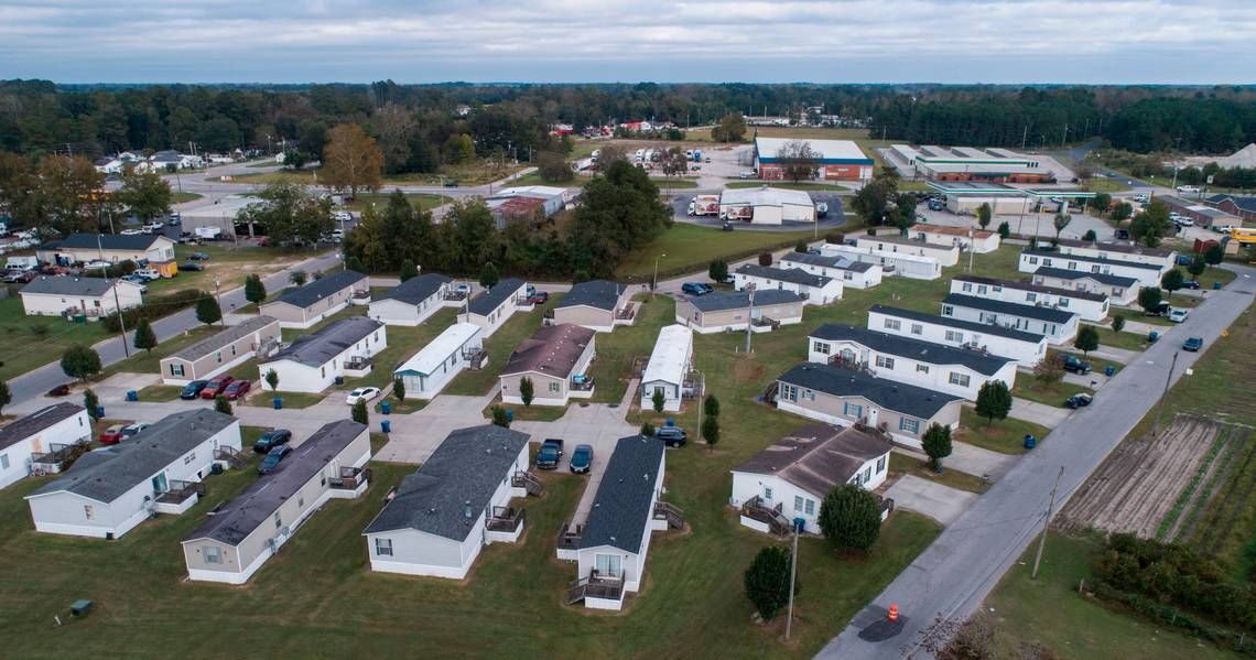 Abbott Park, a mobile home park in Lumberton, N.C., pictured here on Friday, Oct. 16, 2020, is owned by Time Out Communities. According to an Associated Press report, the company bought almost all of the mobile home parks in Lumberton after Hurricane Florence. Researchers examining the health effects of rising temperatures in counties like Robeson, which is located in the Sandhills region of the state, are looking at how higher temperatures can impact residents of mobile home parks and exacerbate social vulnerabilities. Image by Julia Wall / The News & Observer. United States, 2020. 