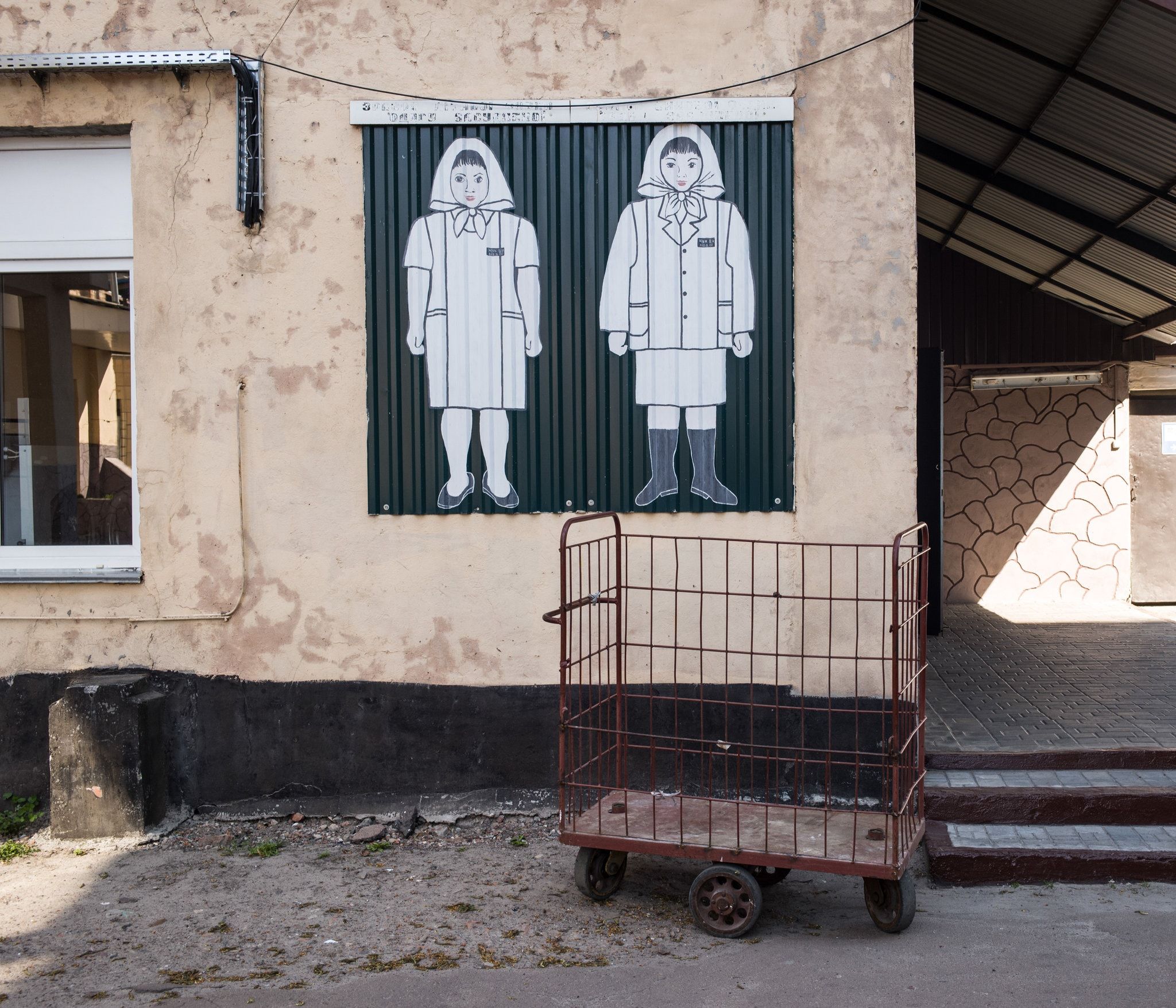 Sign depicting seasonal prison uniforms at the women’s prison in Chernigov. Image by Misha Friedman. Ukraine, undated.
