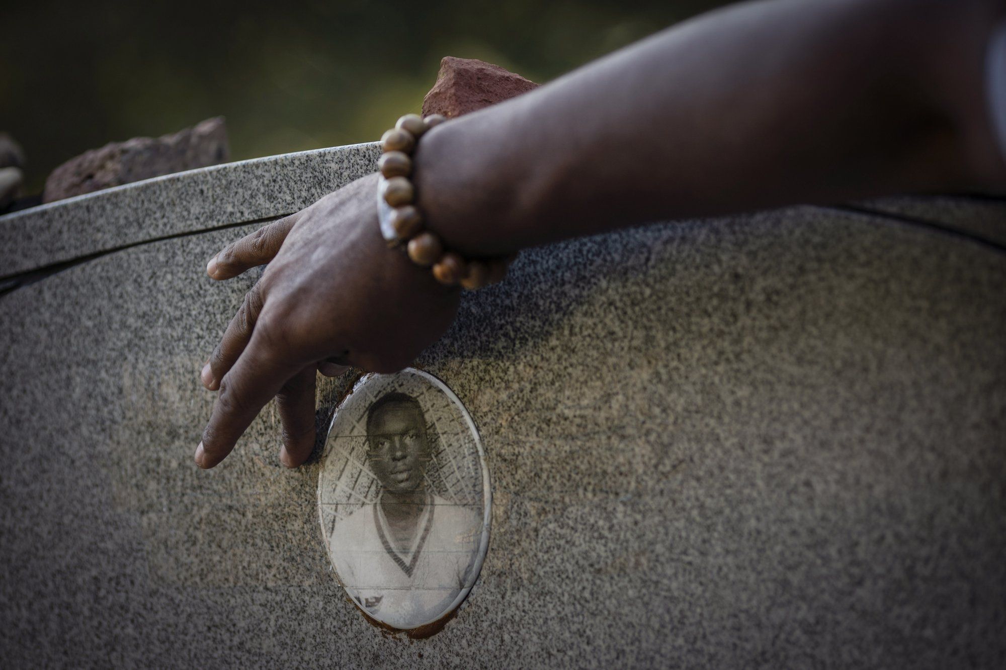 A portrait of James Chaney is seen on the headstone of his grave in Meridian, Miss., Saturday, Oct. 3, 2020. Chaney was one of three civil rights activists that was kidnapped by a deputy sheriff and local Klansmen, and driven to a narrow country road and shot at close range. Their bodies, buried in an earthen dam, were found 44 days later. Image by Wong Maye-E / The Associated Press. United States, 2020.