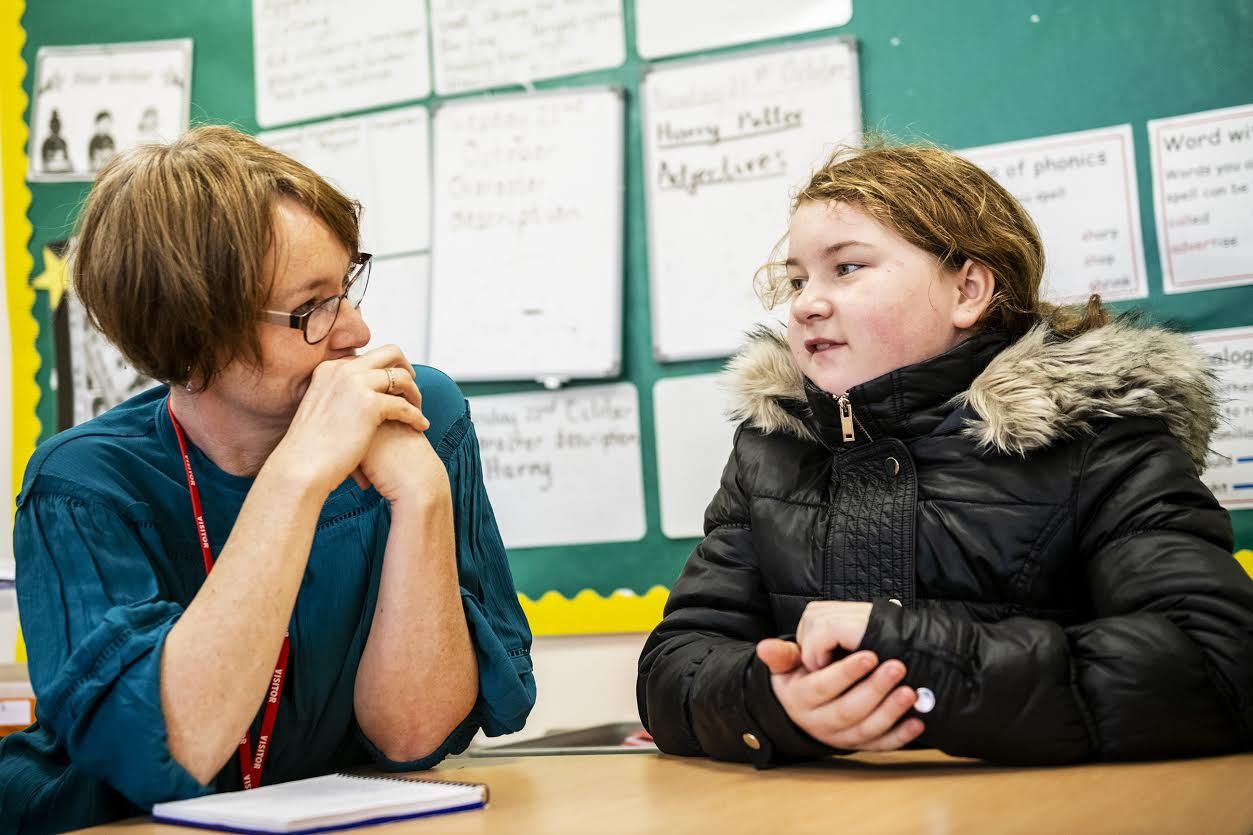 Sarah Ward, researcher, Children's Neighbourhoods Scotland, left, listens as Morgan McNelis, 10, of Parkhead, speaks about life in Glasgow and what she gained from being in the program, Wednesday, Oct. 23, 2019 at Dalmarnock Primary School in Glasgow, Scotland. Image by Michael M. Santiago/Post-Gazette. United Kingdom, 2019.