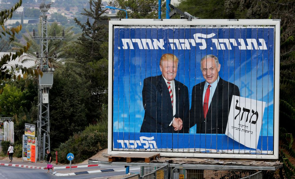 An Israeli election billboard for the Likud party showing President Donald Trump shaking hands with Israeli Prime Minister Benjamin Netanyahu in Beth Shemesh, Israel on September 8, 2019. Image by Gil Cohen Magen / Shutterstock. Israel, 2019.
