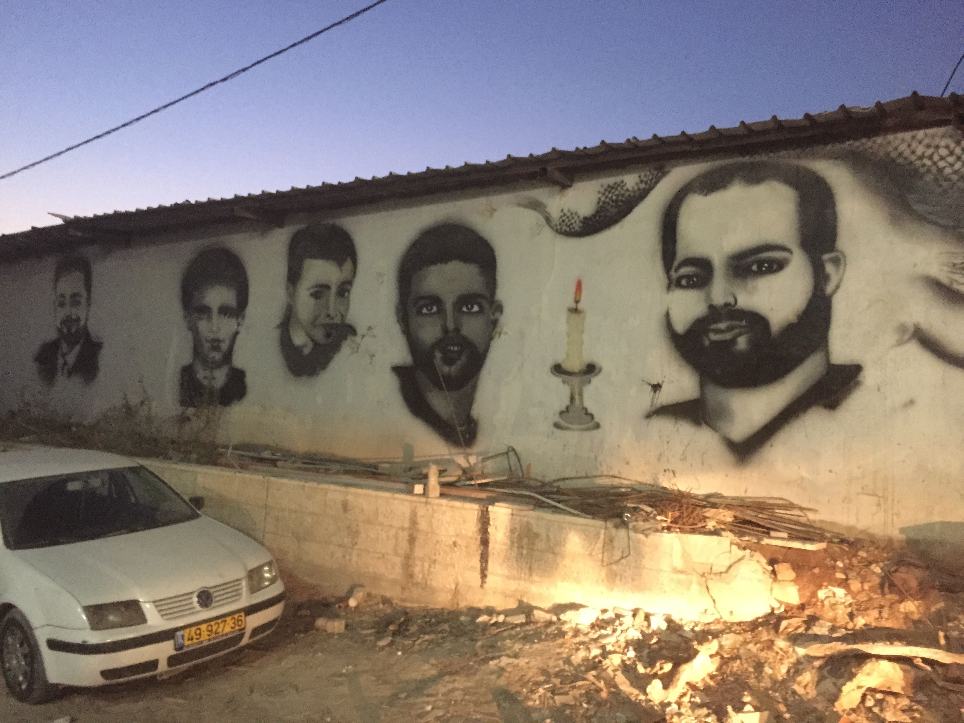 Murals of Palestinians killed by Israel decorate the walls around Qalandia village near the checkpoint. Image by Matt Kennard. Palestine, 2016.
