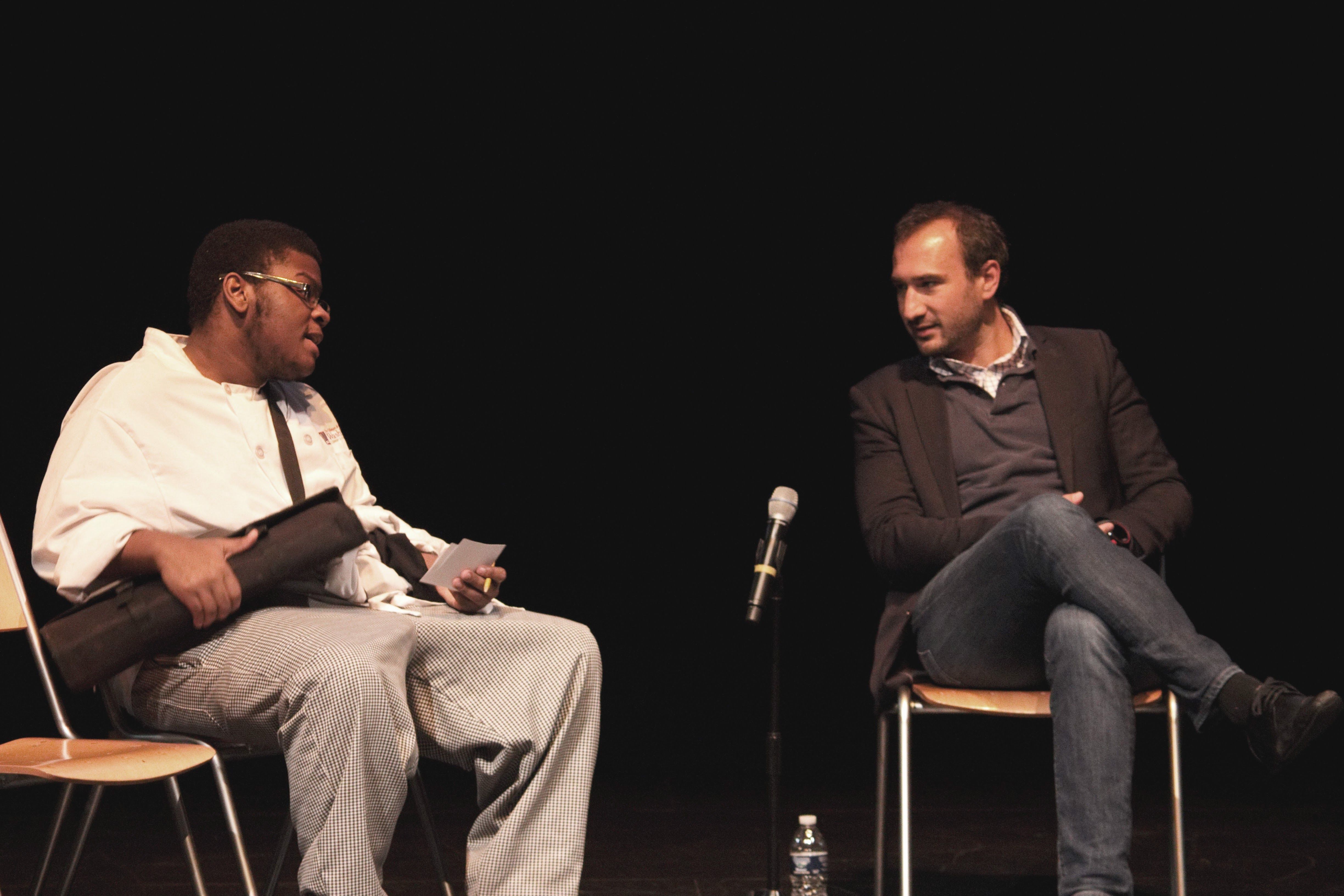 A Washburne Culinary Institute student asks Karim Chrobog questions about food waste after the screening of 'Wasted.' Image by Lauren Shepherd. U.S., 2016.
