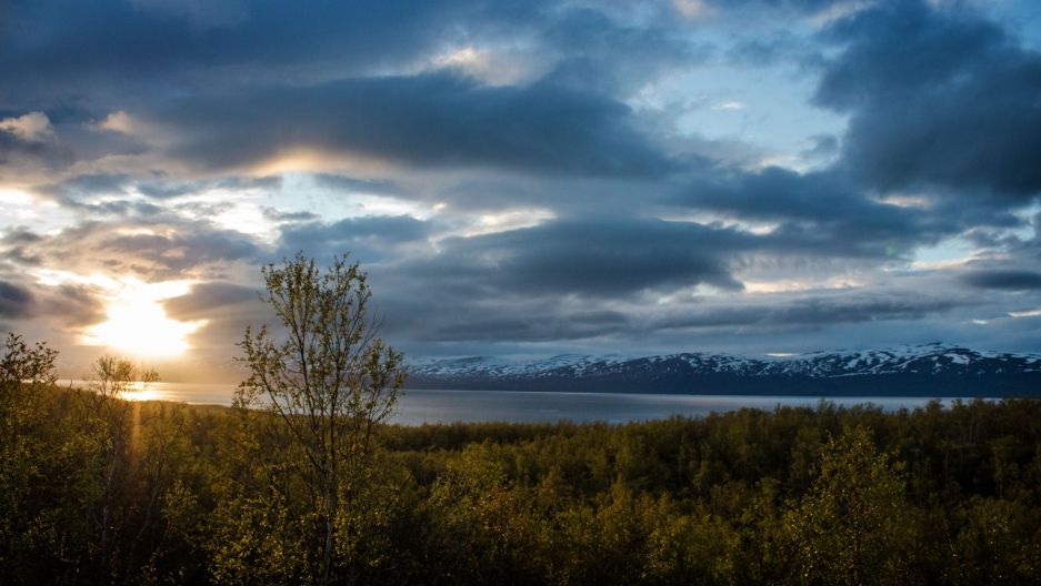 The sun sets over the water near Abisko, Sweden. Image by Amy Martin. Sweden, 2018.