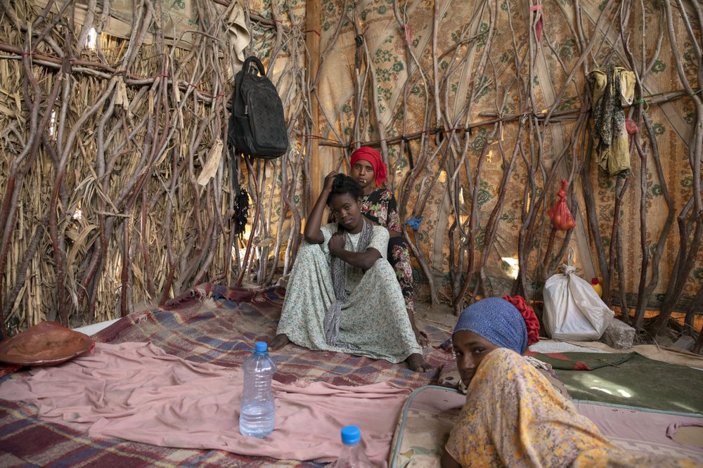 Ethiopian migrant girls sit inside in a compound known in Arabic as a "hosh," in Ras al-Ara, Lahj, Yemen. Meanwhile, more than 150,000 migrants landed in Yemen in 2018, a 50% increase from the year before, according to the International Organization for Migration. Image by Nariman El-Mofty. Yemen, 2019.