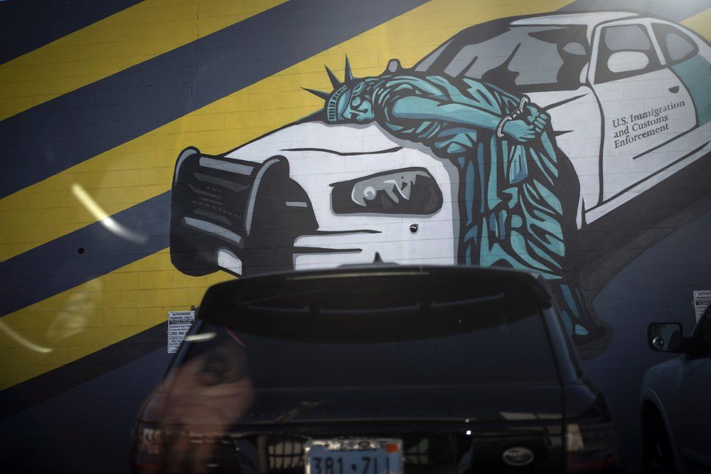 A car is parked in front of a mural in downtown Las Vegas, Tuesday, Nov. 10, 2020. For decades, the working-class neighborhoods that circle Las Vegas called out to foreigners, who came from dozens of other countries, especially Mexico. They changed Las Vegas and Nevada. One in five of the state's residents are immigrants, according to the American Immigration Council, and one in six are native-born citizens with at least one immigrant parent. Image by Wong Maye-E / AP Photo. United States, 2020.