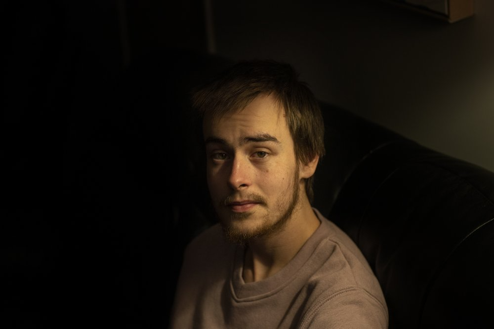 Sam Ware, 22, sits for a photo in his mother's home, in Fountaindale, Central Coast, Australia, Friday, July 19, 2019. Image courtesy of David Goldman. Australia, 2019.