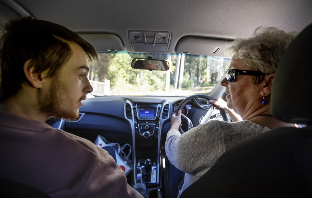 Deb Ware, right, drives her son, Sam, back to her home for the first time since she last found him overdosing there three weeks earlier in Fountaindale, Central Coast, Australia, Friday, July 19, 2019. Image courtesy of David Goldman. Australia, 2019. 