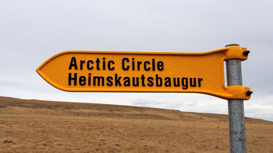 One of the signs on Grímsey Island denotes the Arctic Circle, though the circle itself moves from year to year and is currently moving off Grímsey Island entirely. Image by Amy Martin. Iceland, 2018.