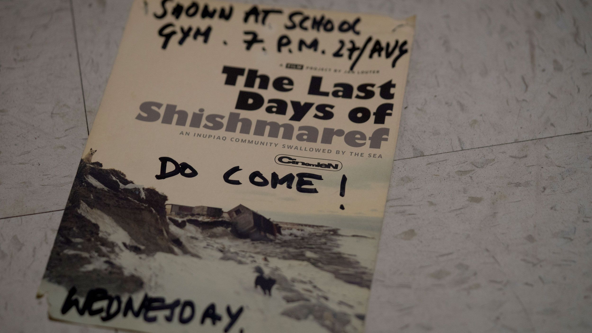 A flyer invites residents to a screening of "The Last Days of Shishmaref." Someone has added a handwritten "Do Come!" to the flyer. Image courtesy of Nick Mott. United States, 2018.