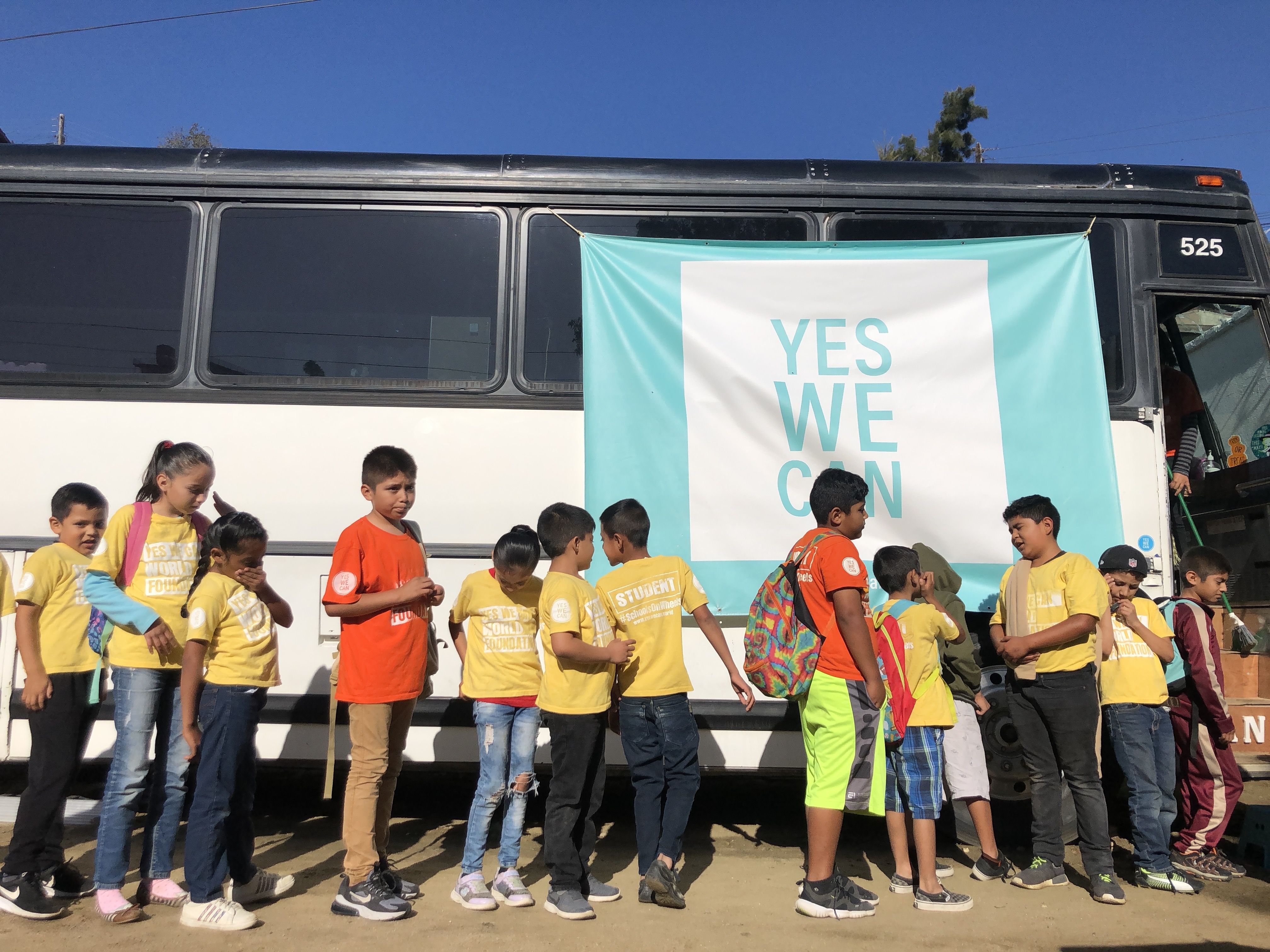 Students in Tijuana prepare for a day of learning aboard the Yes We Can World Foundation school bus. Soon, Rebellón hopes to open a new school for migrant kids in Juárez, across the border from El Paso, Texas. Image by Jaime Joyce. Mexico, 2019.