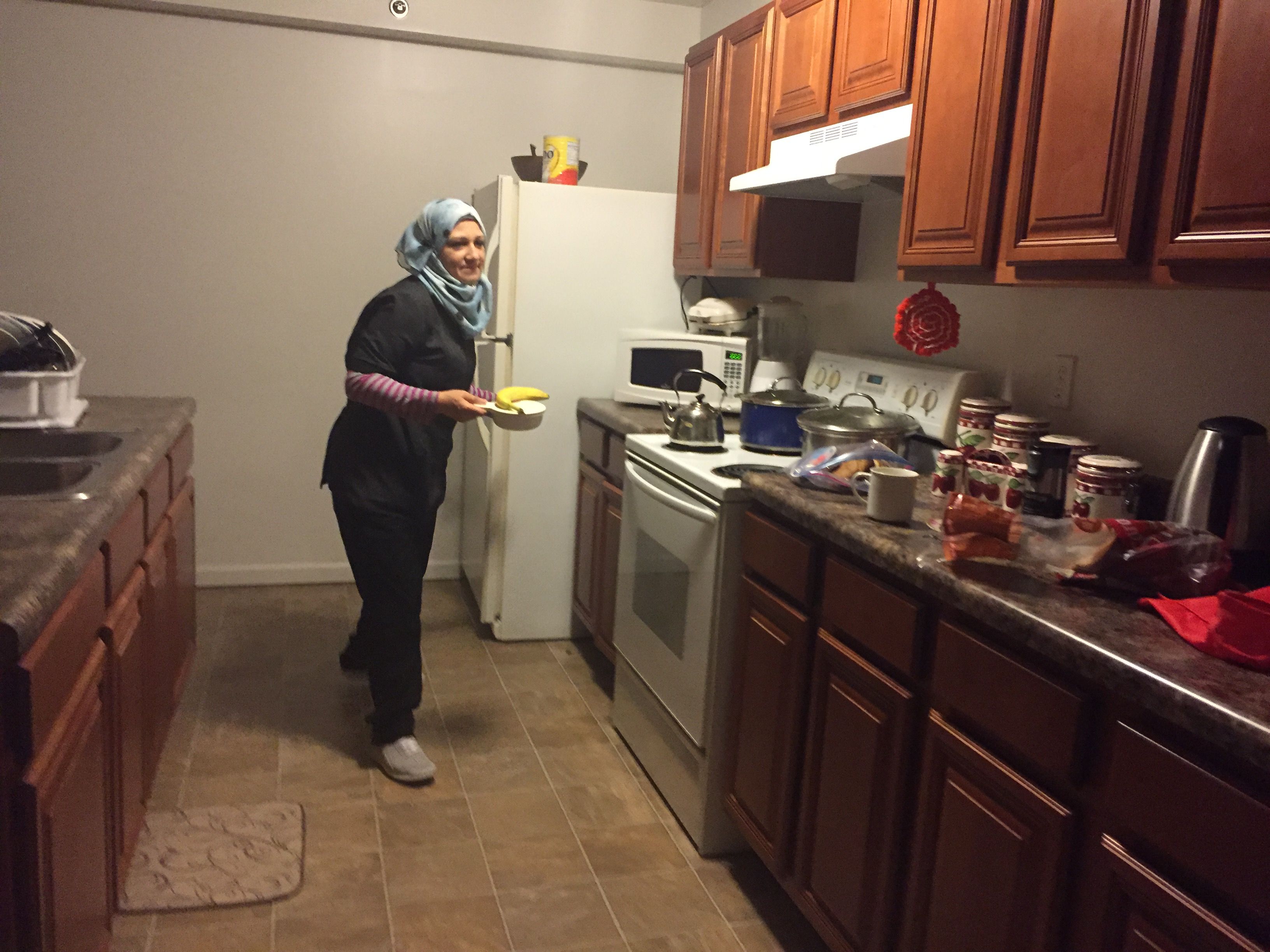 When Ghazweh gets a job cleaning hotel rooms, she wakes up before 5 to commute to go to work and makes breakfast for the children.