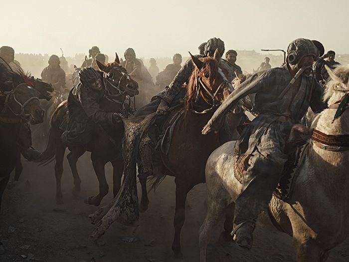Riders battle for the calf at a buzkashi event in Balkh province, northern Afghanistan. Image by Balazs Gardi. 