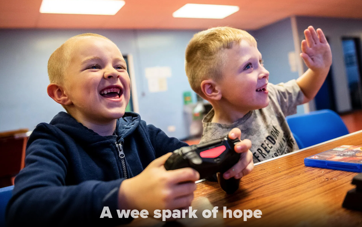 Kyle Hamilton, 7, left, and Lucas Barpon, 7, both of Possilpark, play a wrestling video game on a Playstation during a Young People's Futures session, Oct. 25, 2019, at Possilpoint Community Centre in Possilpark, Glasgow, Scotland. Image by Michael Santiago. United Kingdom, 2019.