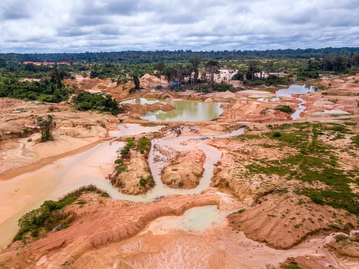 An aerial view of a deforested area of the Amazon rainforest caused by illegal mining activities in Brazil. Image courtesy of Shutterstock. Brazil.