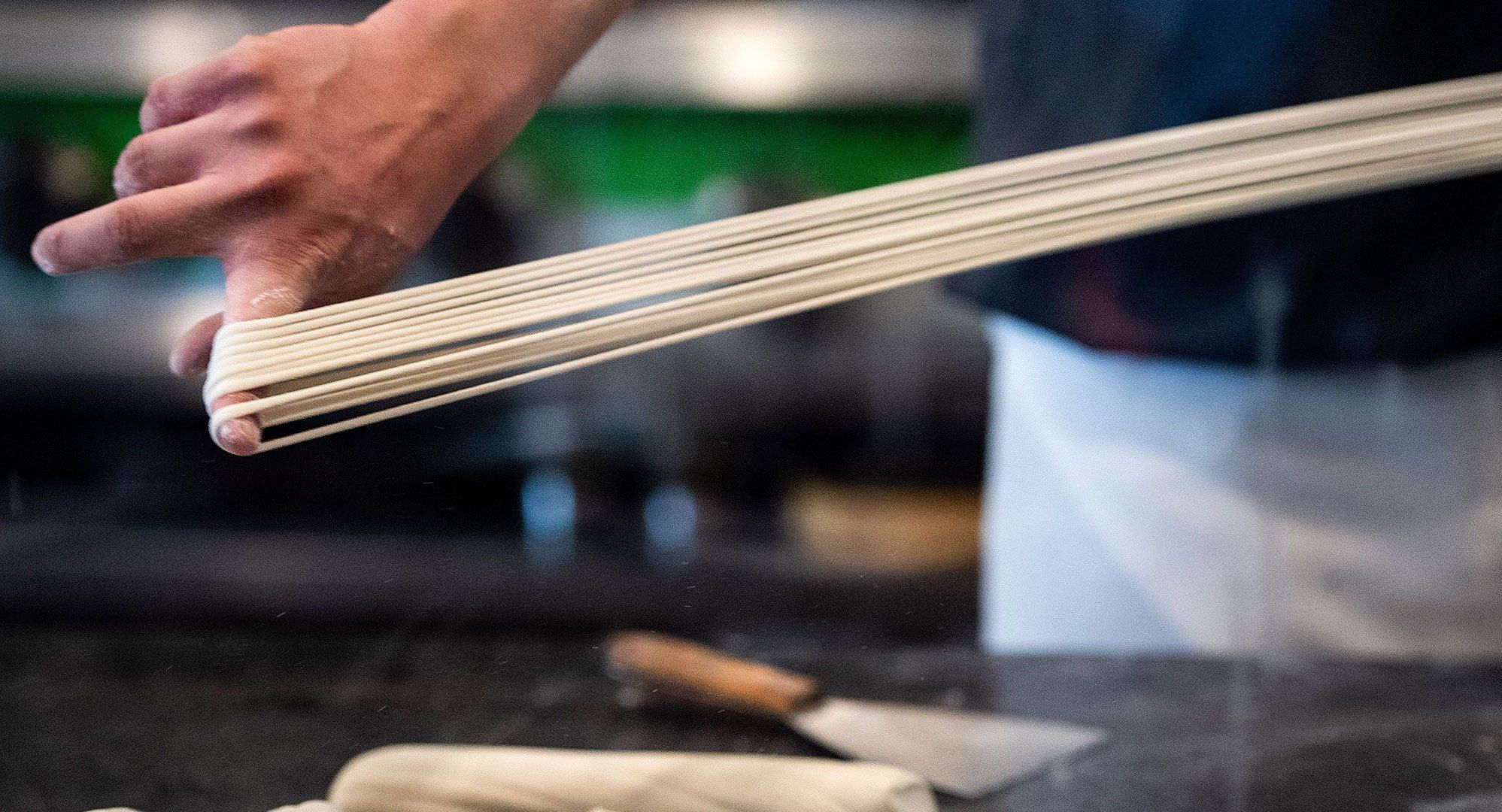 Tony Mao makes hand-pulled noodles at Everyday Noodles. Image by Stephanie Chambers. United States, 2018. 