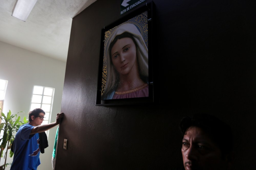 In this Oct. 10, 2019 photo, Mexican migrants wait to make a flight reservation with the help of nuns who run a shelter for migrants in Reynosa, Mexico. The factory city of about 650,000 is the largest in the state of Tamaulipas and home to some of the worst drug war violence. It’s also a key part of the migratory route and one of the busiest crossing points along with Ciudad Miguel Aleman. Image by Fernando Llano. Mexico, 2019.