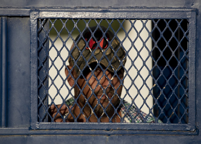 In this Oct. 12, 2019 photo, a Cuban exits a migrant shelter in Reynosa, Mexico. In years past, migrants seeking asylum in the United States moved quickly through this violent territory on their way to the U.S., but now due to Trump administration policies, they remain here for weeks and sometimes months as they await their U.S. court dates, often in the hands of gangsters who hold Tamaulipas state in a vice-like grip. Image by Fernando Llano. Mexico, 2019.