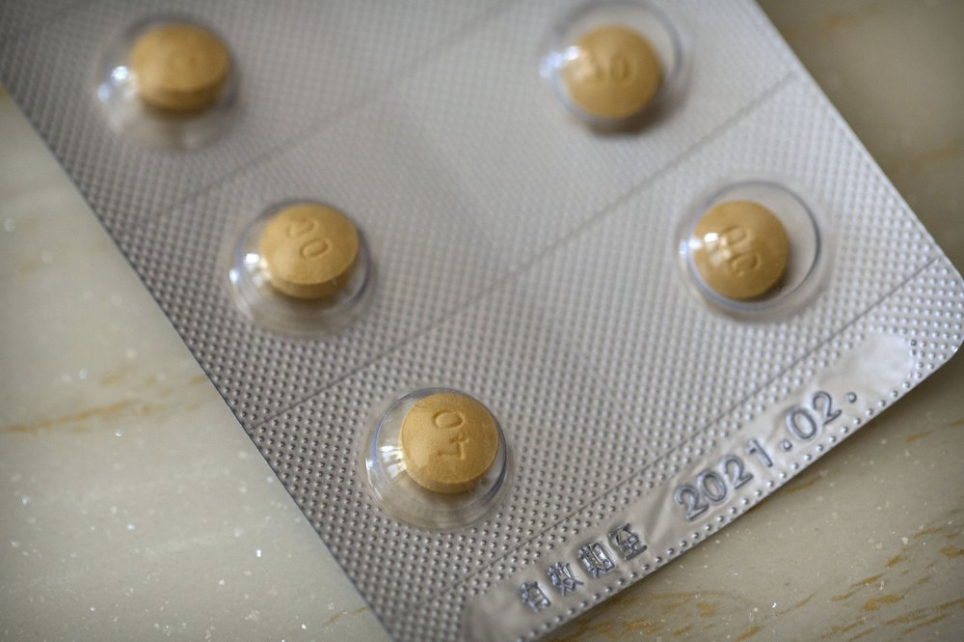 This Sept. 24, 2019 photo shows 40-milligram Oxycontin tablets sold in China in Hunan province. China fought two wars in the 19th century to beat back British ships dumping opium that fueled widespread addiction. Today, the cultural aversion to taking drugs, in Chinese, literally "sucking poison", is so strong addicts can be forced into police-run treatment centers. Image by Mark Schiefelbein / AP Photo. China, 2019.