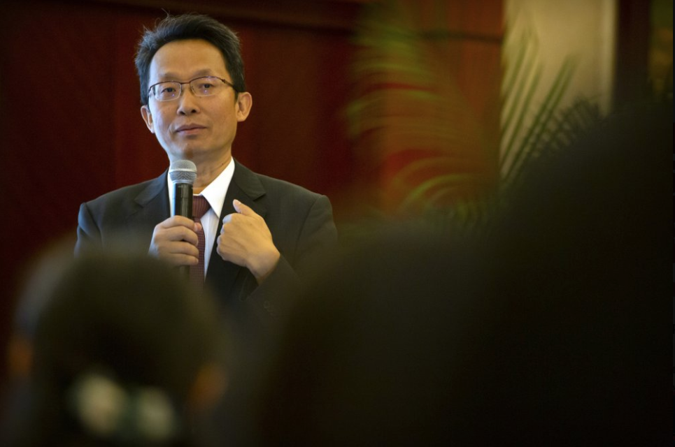 Dr. Fan Bifa, director of the pain clinic at the China-Japan Friendship Hospital in Beijing, speaks at a medical conference in Beijing, China on May 23, 2019. Fan told The Associated Press he has never taken money directly from Mundipharma. Image by Mark Schiefelbein / AP Photo. China, 2019.