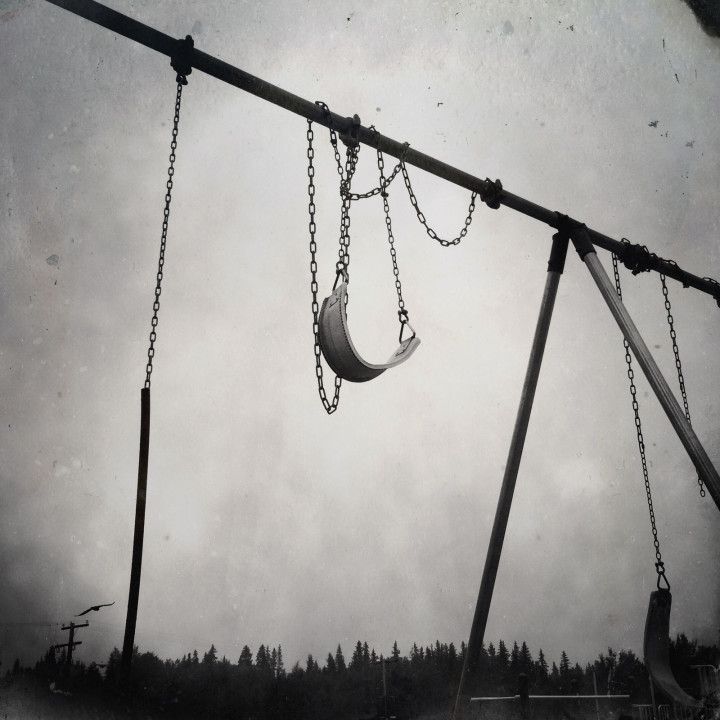 A swingset in Beauval, Saskatchewan, near the former site of the Beauval Indian Residential School. Image by Daniella Zalcman. Canada, 2015.